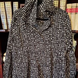 Dressed to kill.  Women's Black and White Patterned blouse. Double collar.